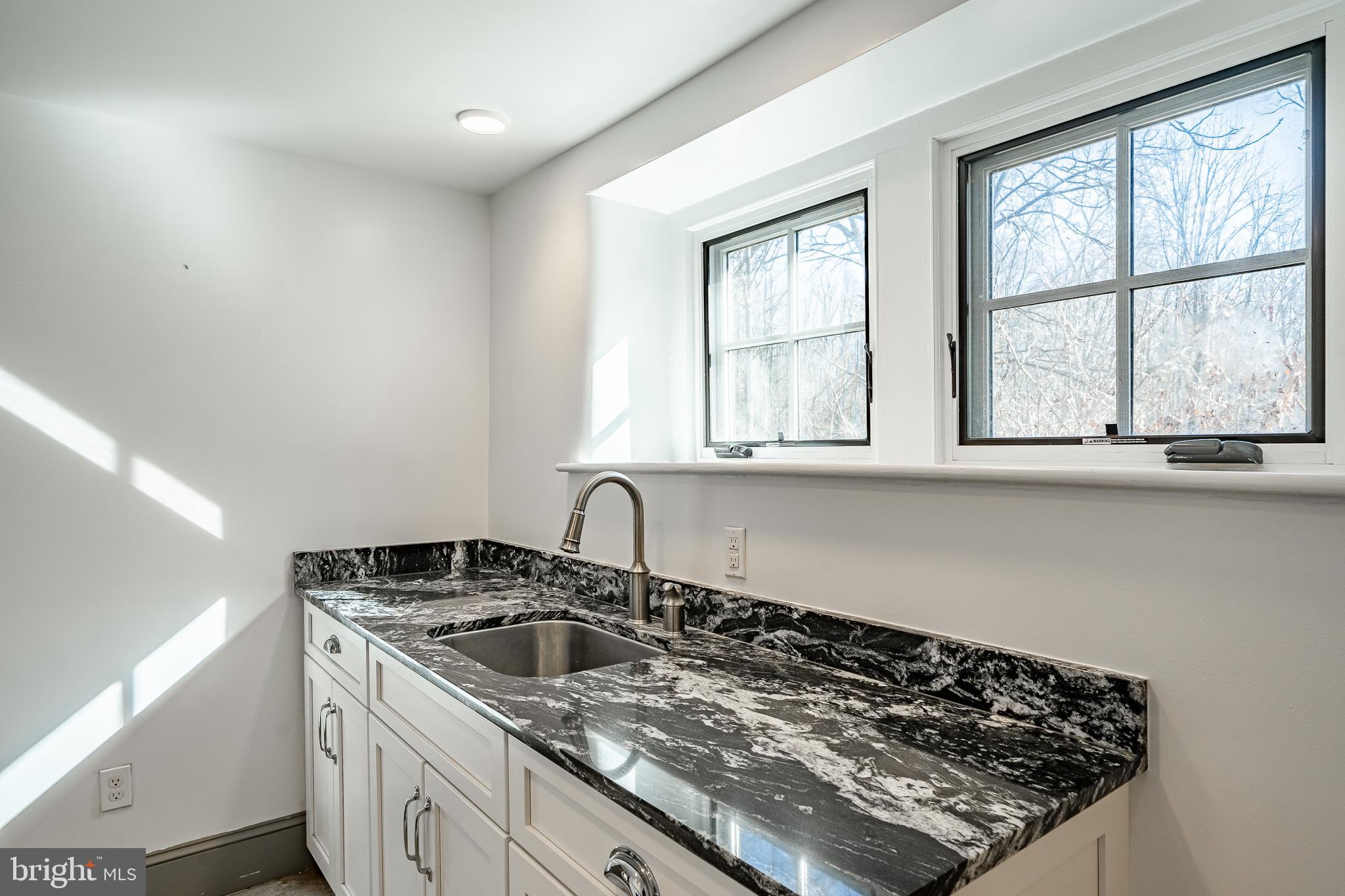 768 Forgedale Road Barto, PA 19504 - Photo 20 of 49 a kitchen with a stove a sink and a window