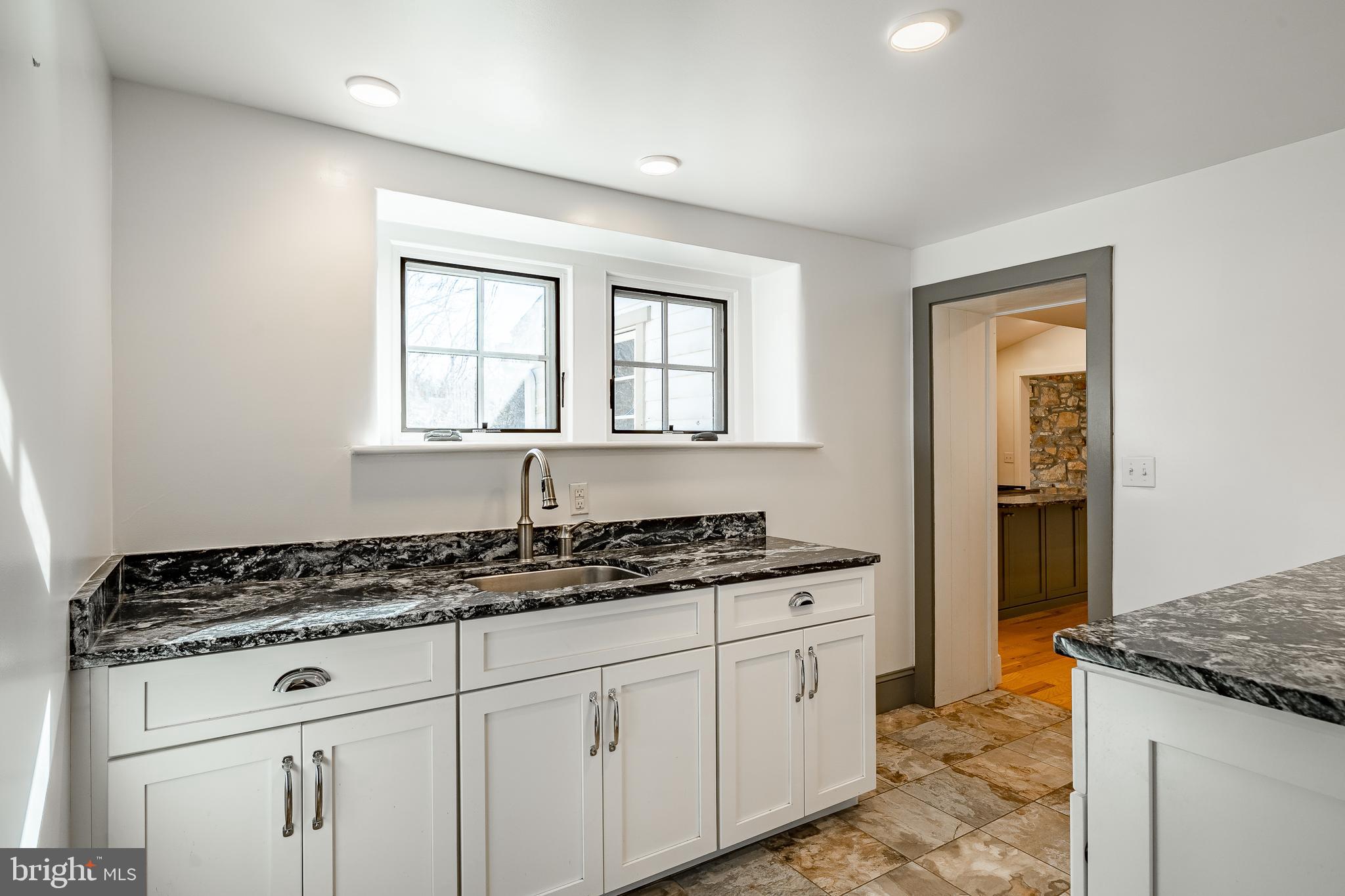 768 Forgedale Road Barto, PA 19504 - Photo 22 of 49 a kitchen with white cabinets and appliances