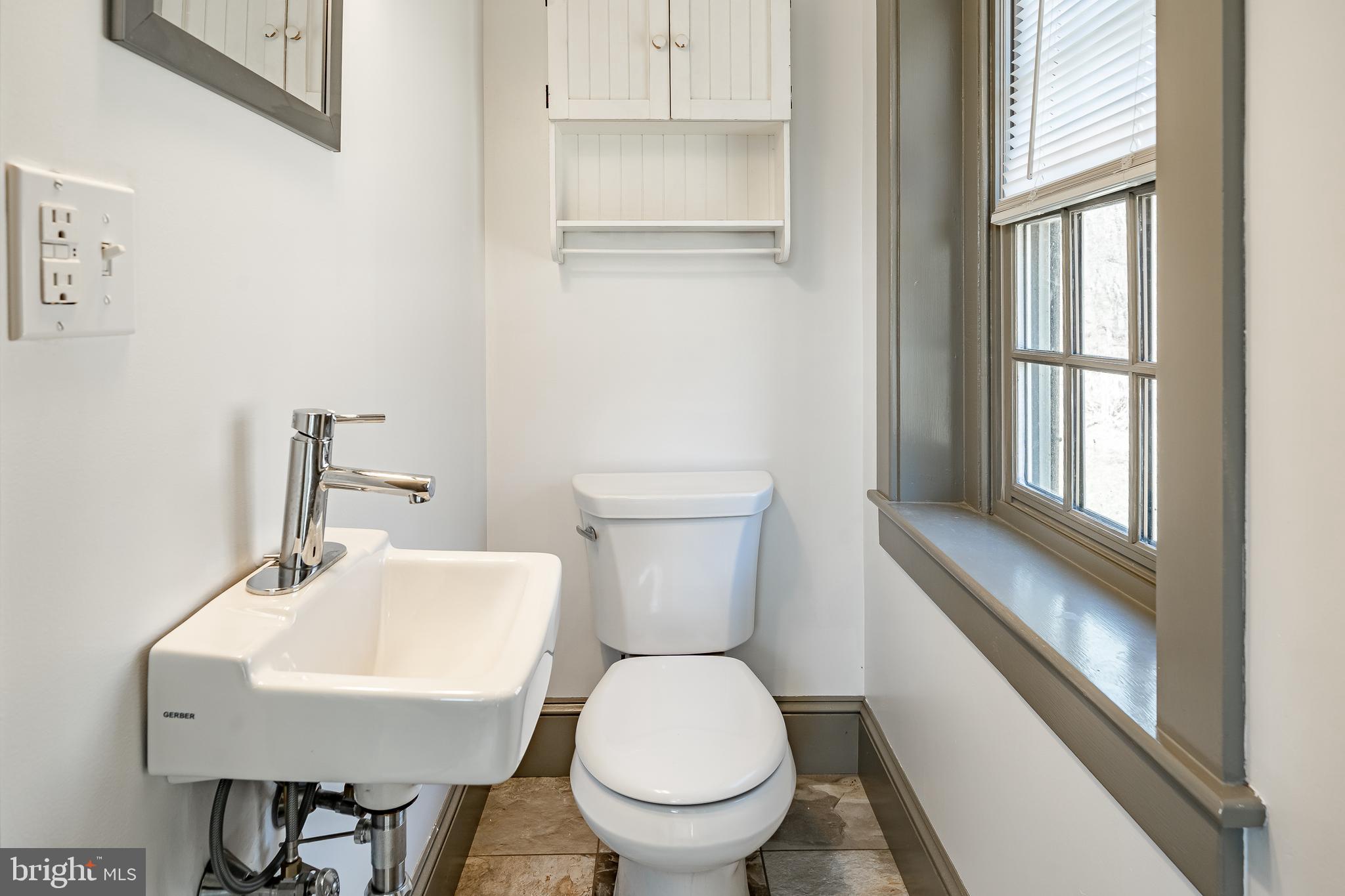 768 Forgedale Road Barto, PA 19504 - Photo 23 of 49 a bathroom with a toilet a sink and a window