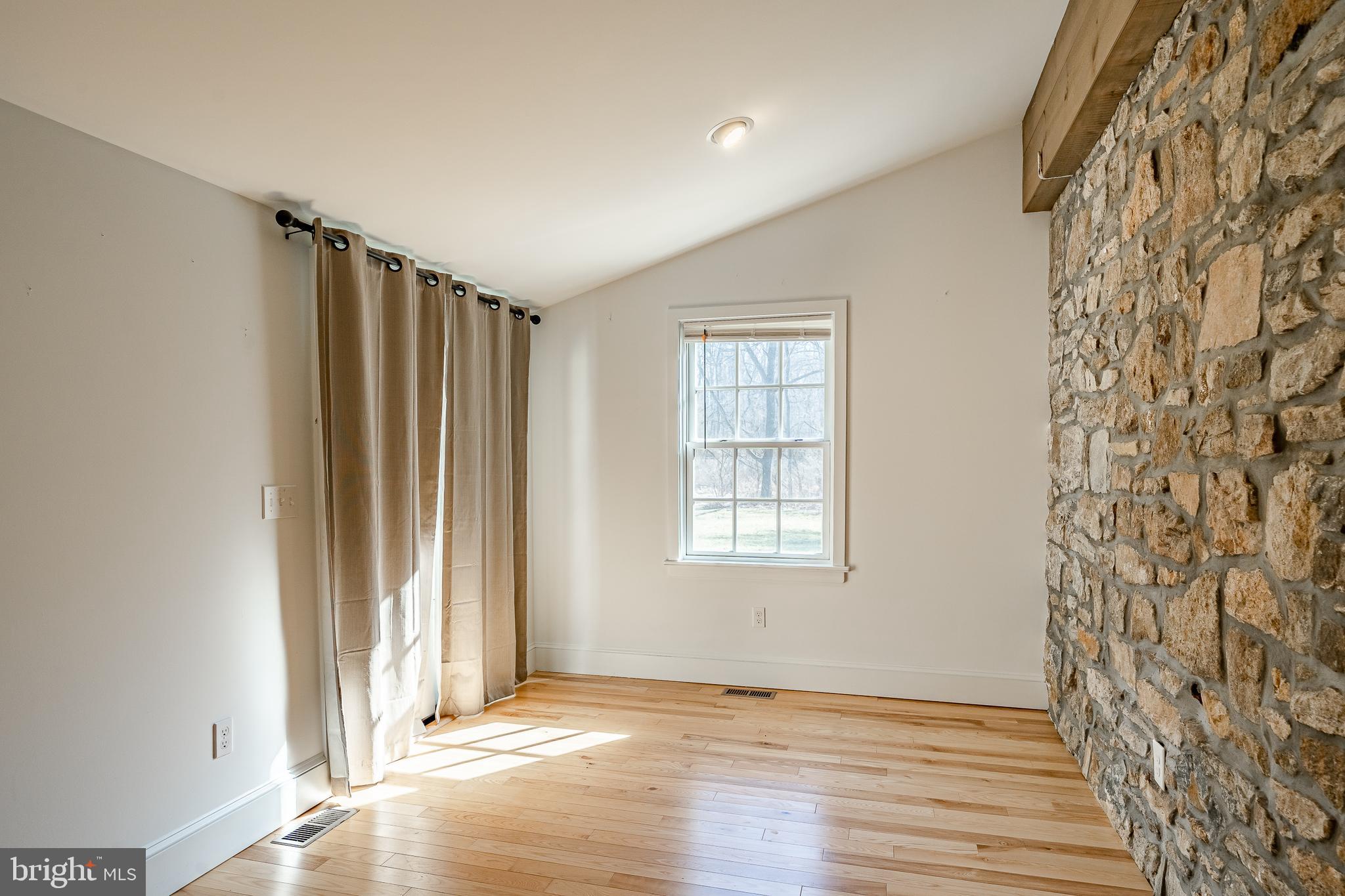 768 Forgedale Road Barto, PA 19504 - Photo 26 of 49 an empty room with wooden floor and windows