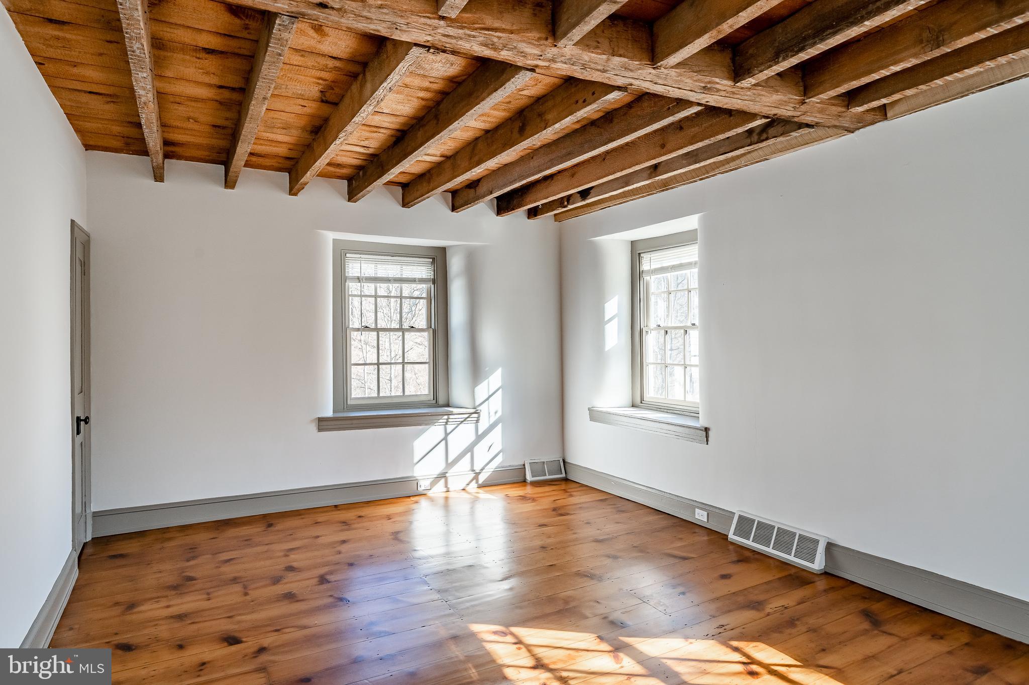 768 Forgedale Road Barto, PA 19504 - Photo 31 of 49 a view of empty room with wooden floor and fan