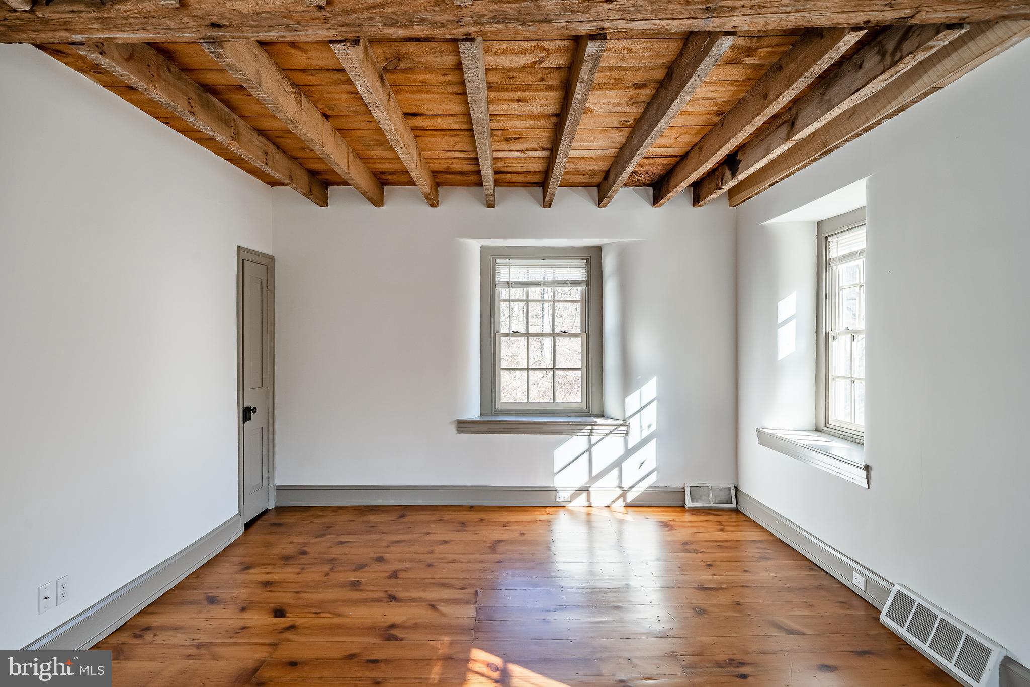 768 Forgedale Road Barto, PA 19504 - Photo 32 of 49 a view of an empty room with wooden floor and a window