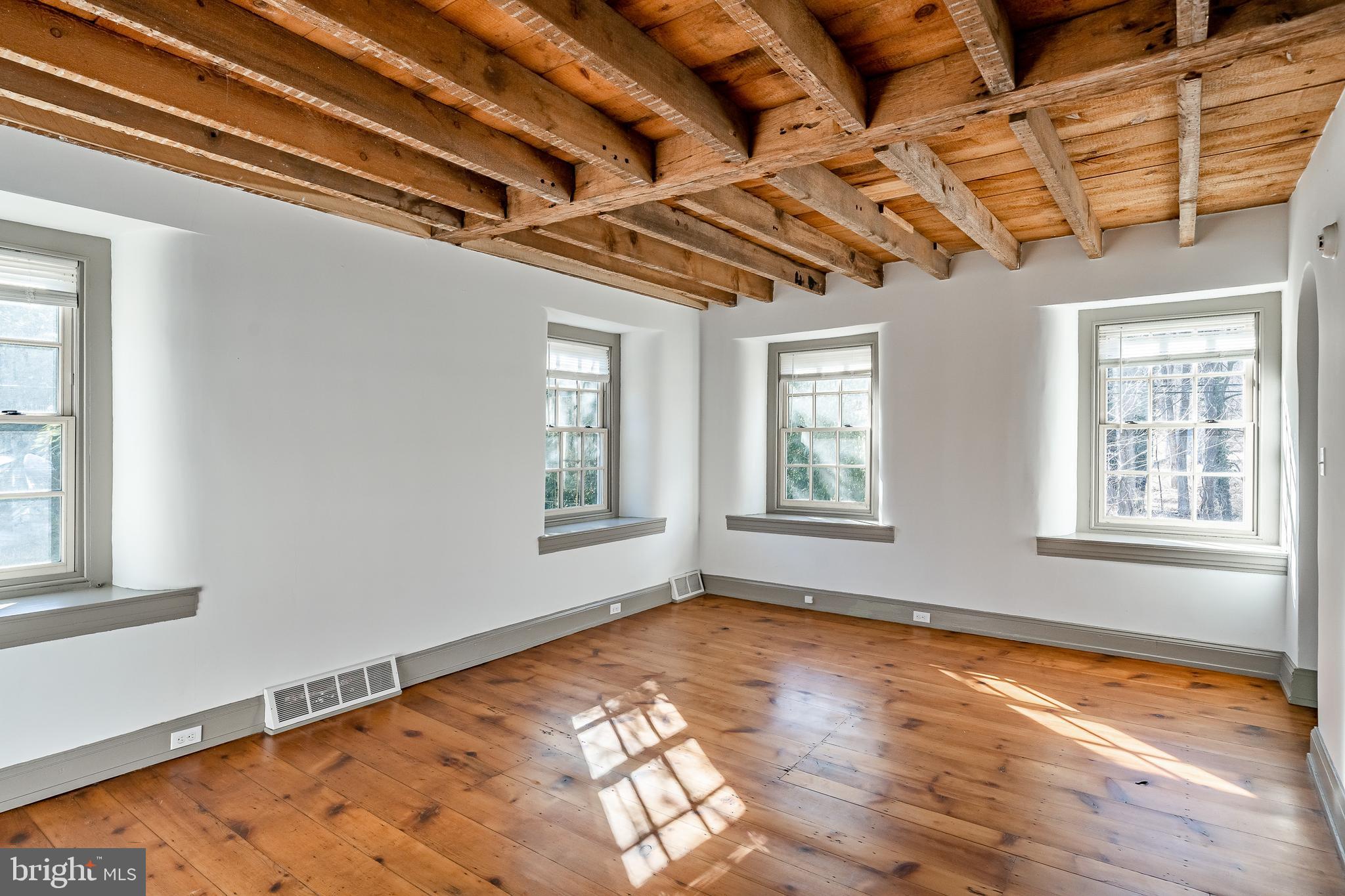 768 Forgedale Road Barto, PA 19504 - Photo 33 of 49 a view of an empty room with wooden floor and a window