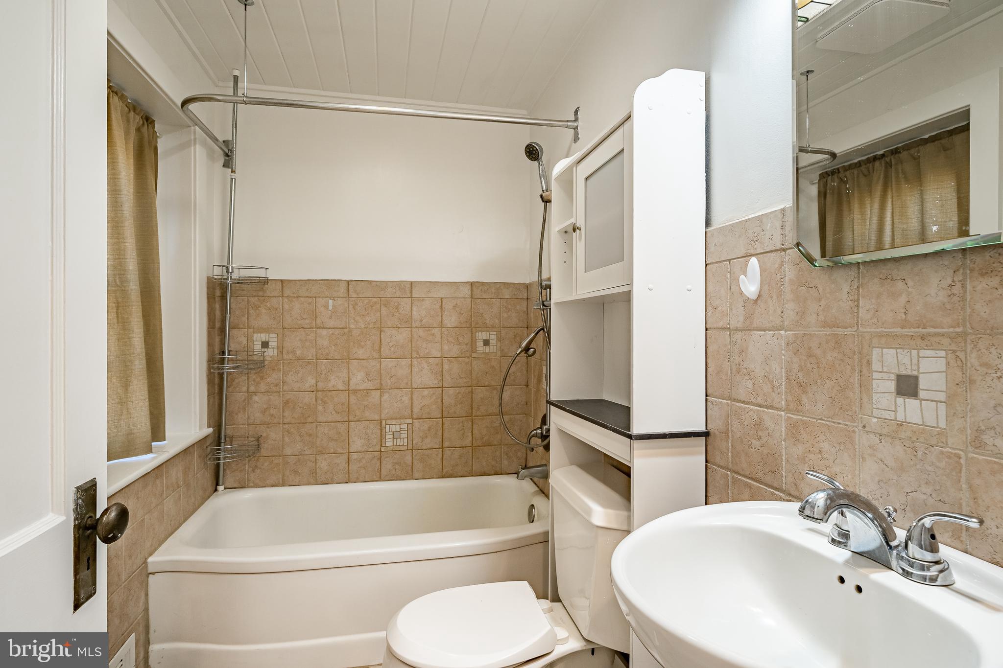768 Forgedale Road Barto, PA 19504 - Photo 35 of 49 a bathroom with a toilet a sink and bathtub