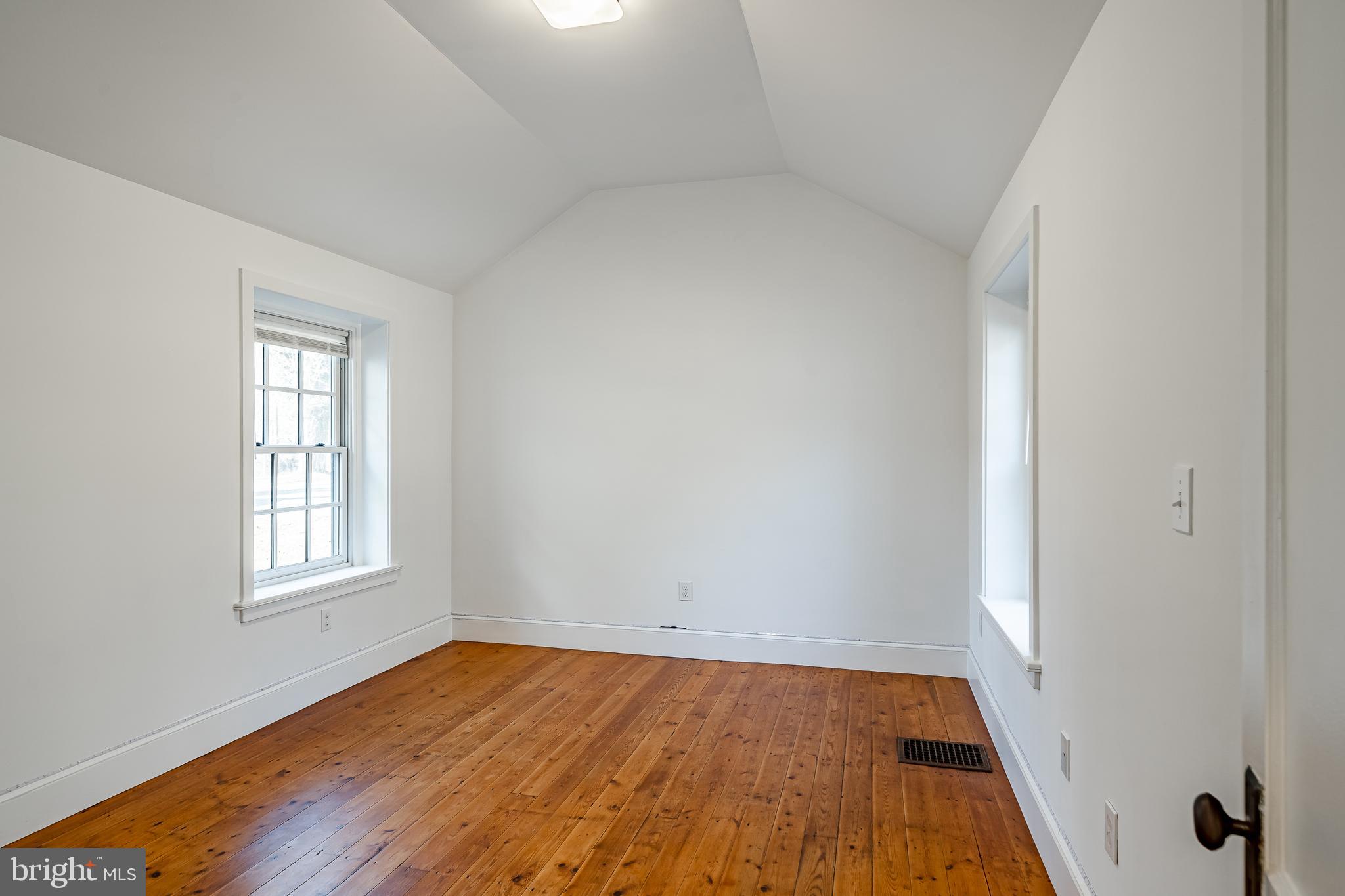 768 Forgedale Road Barto, PA 19504 - Photo 36 of 49 an empty room with wooden floor and windows