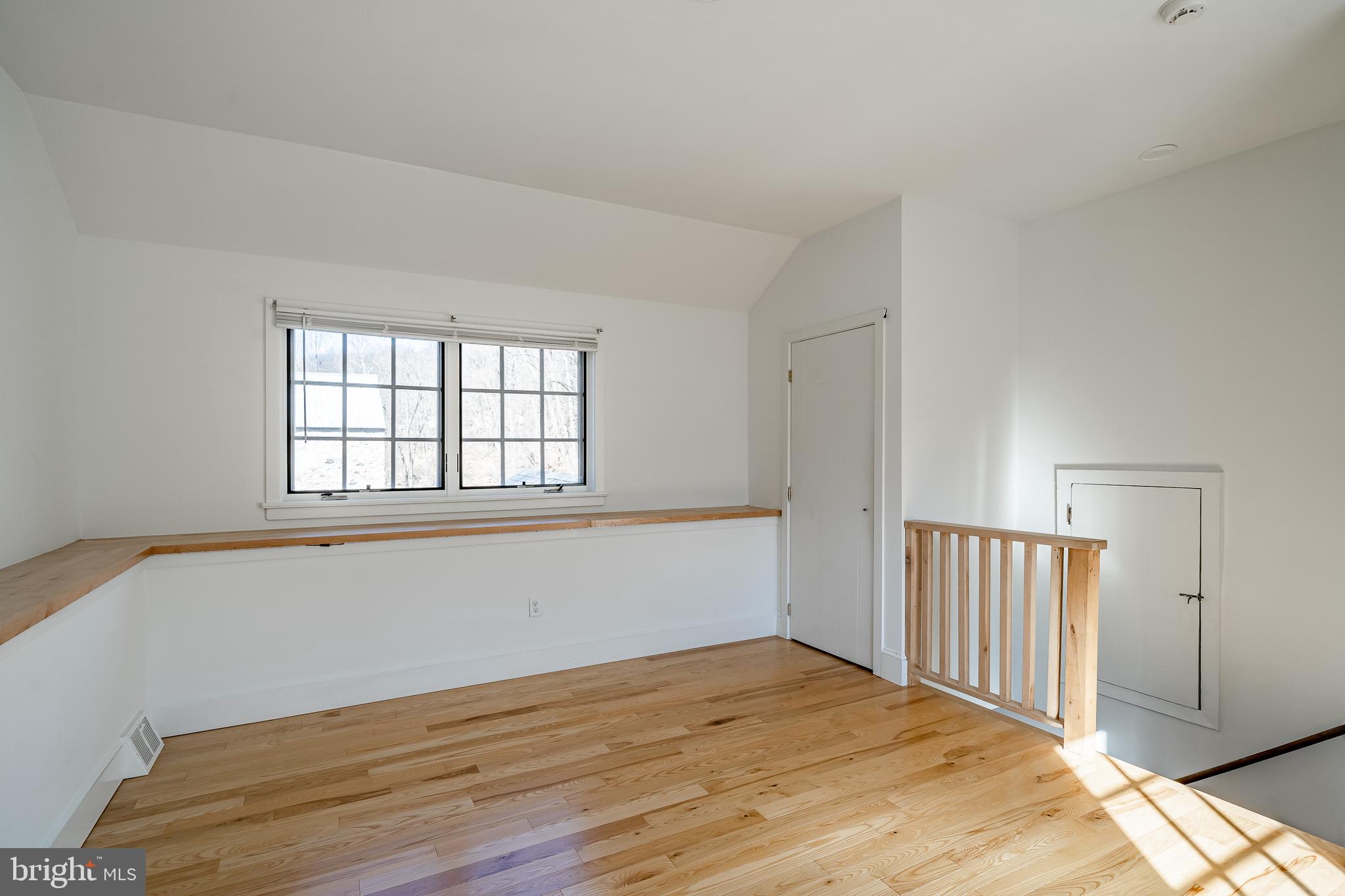 768 Forgedale Road Barto, PA 19504 - Photo 38 of 49 an empty room with wooden floor and windows