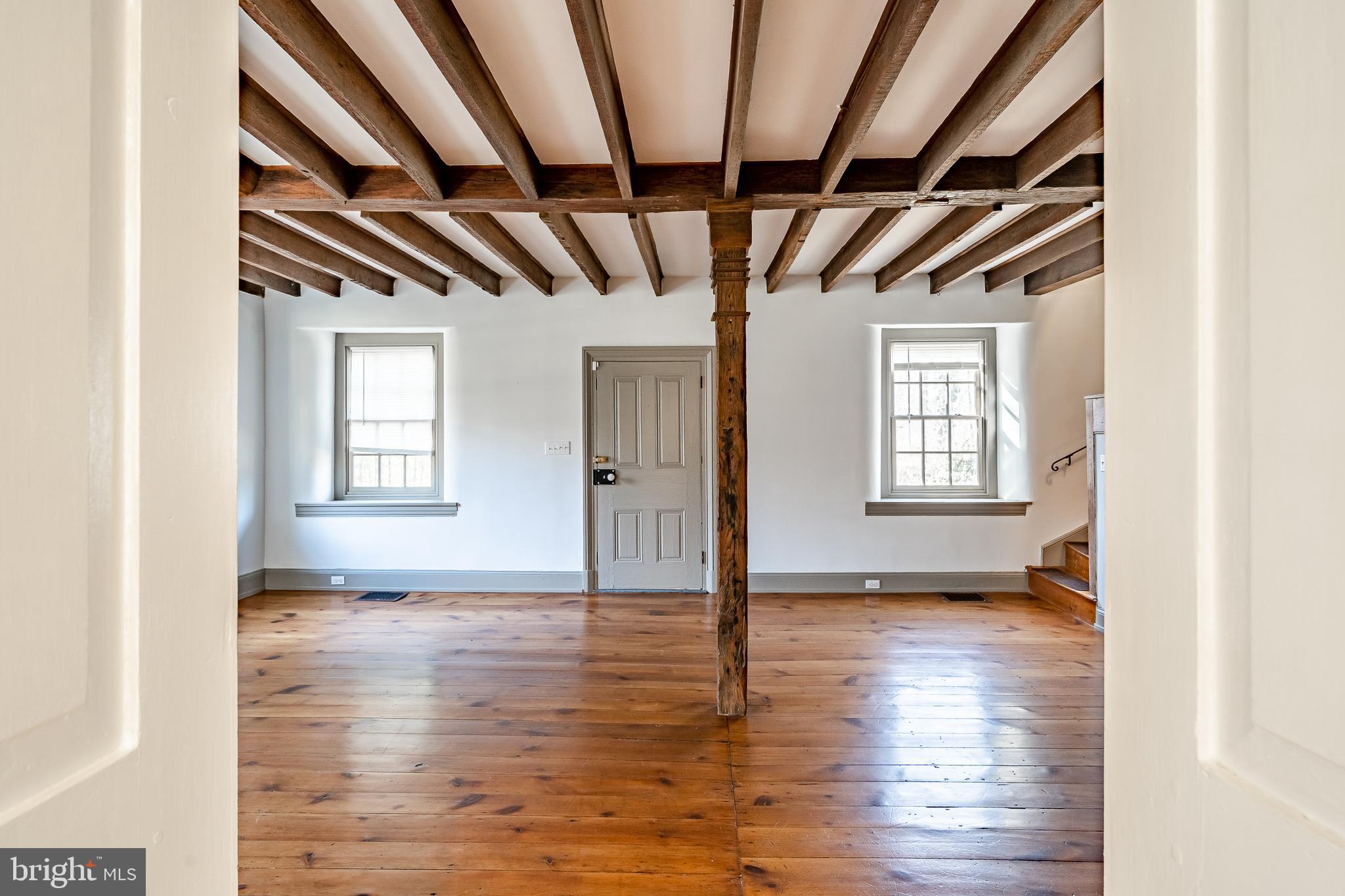 768 Forgedale Road Barto, PA 19504 - Photo 7 of 49 a view of an empty room with wooden floor and a window
