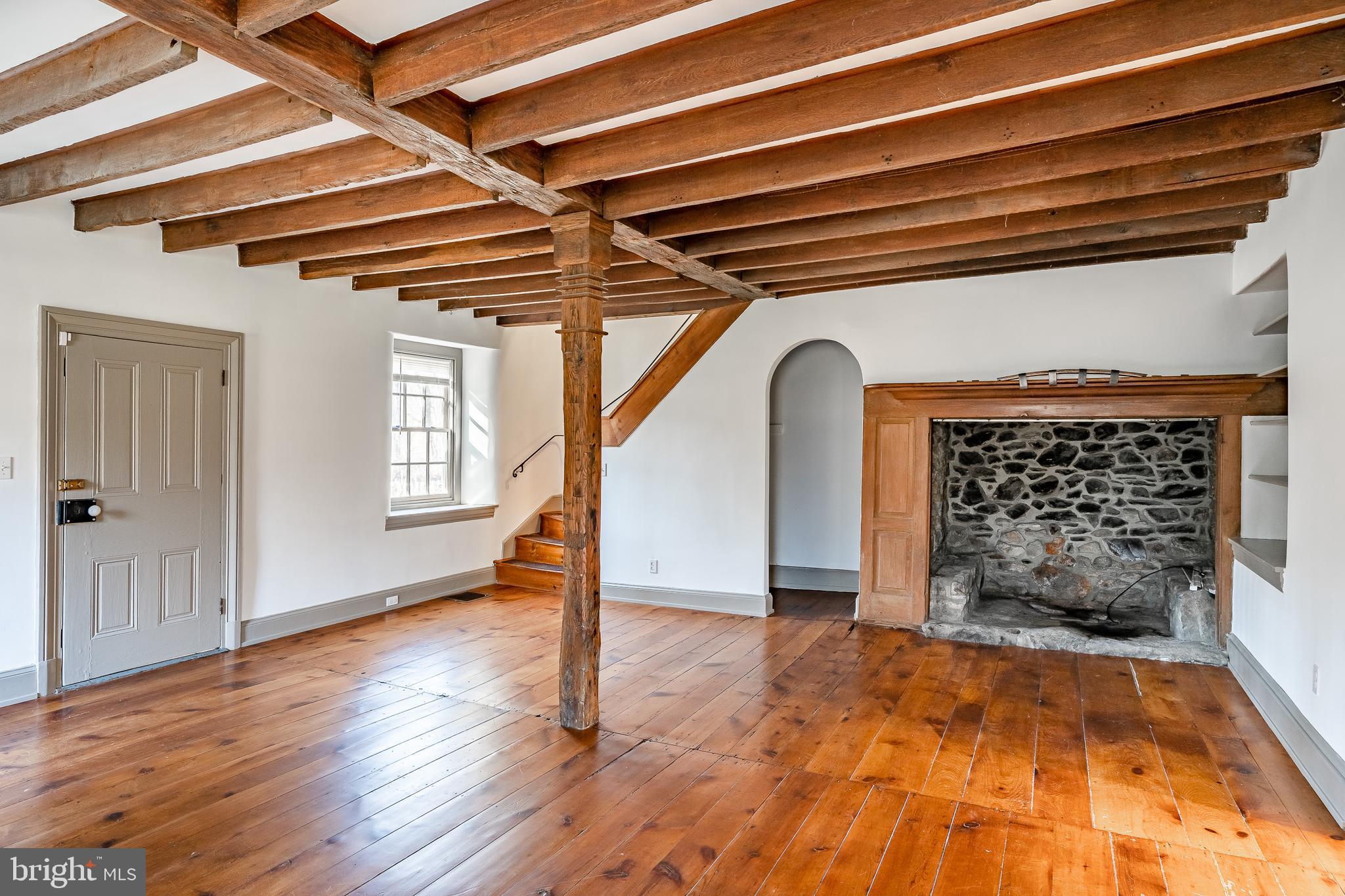 768 Forgedale Road Barto, PA 19504 - Photo 8 of 49 a view of empty room with wooden floor and fireplace