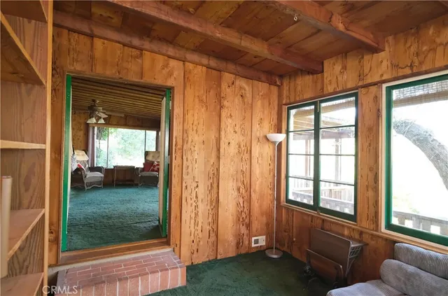 a room with furniture and a large window