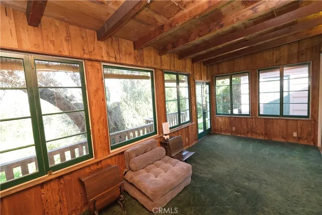 a room with furniture and a large window