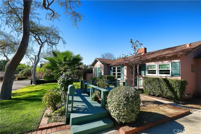 a front view of a house with garden