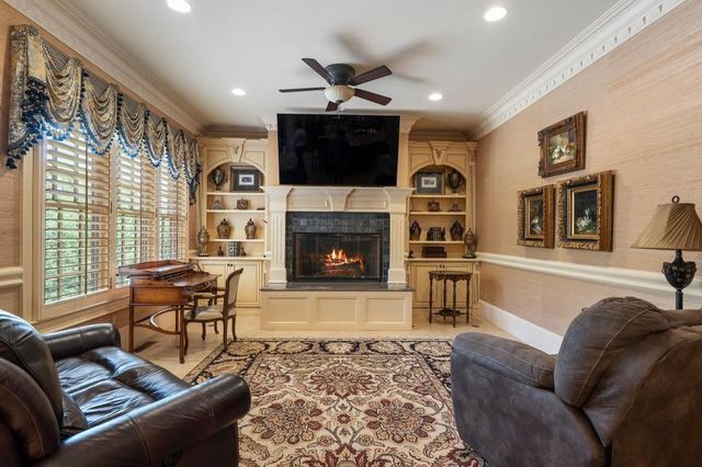 a bed room with furniture and a chandelier