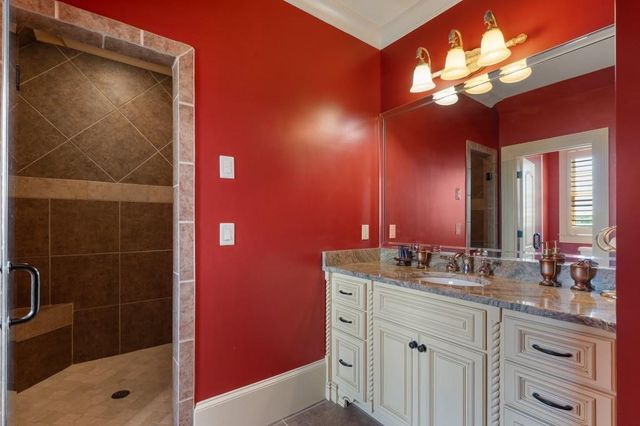 a room with lots of chairs and mirrors