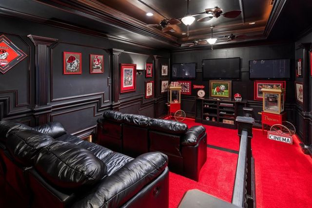 a bedroom with a bed furniture and a large window