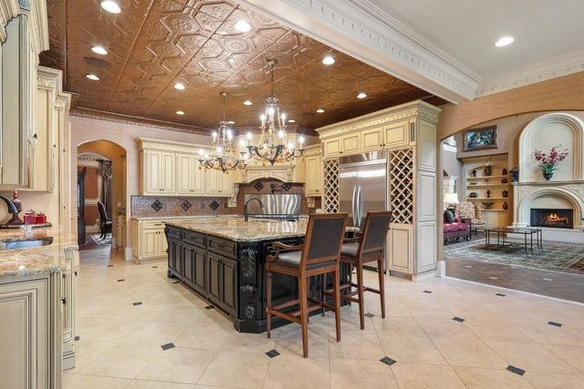 a kitchen with stainless steel appliances granite countertop a stove and a sink