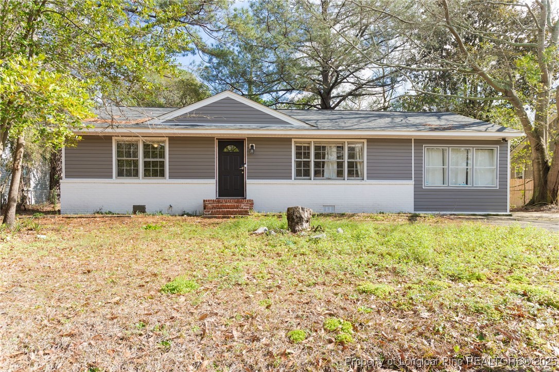 front view of a house with a yard