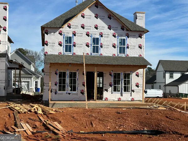 a view of house and garage