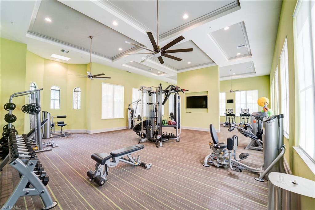 5174 Julienne Road Immokalee, FL 34142 - Photo 10 of 16 Workout area featuring a ceiling fan and coffered ceiling