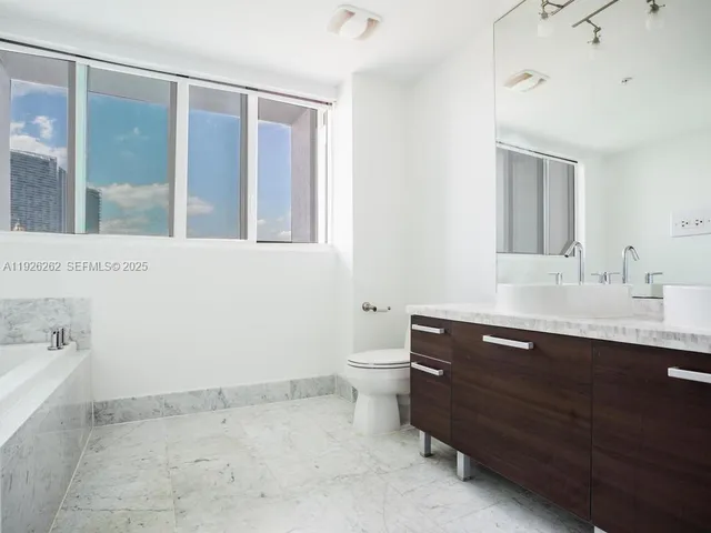 a bathroom with a sink and shower