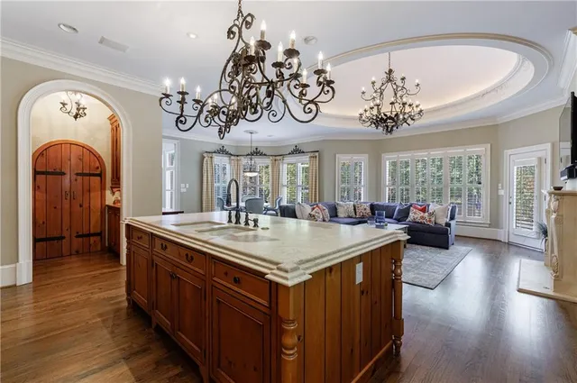 a living room with furniture and a walk in closet