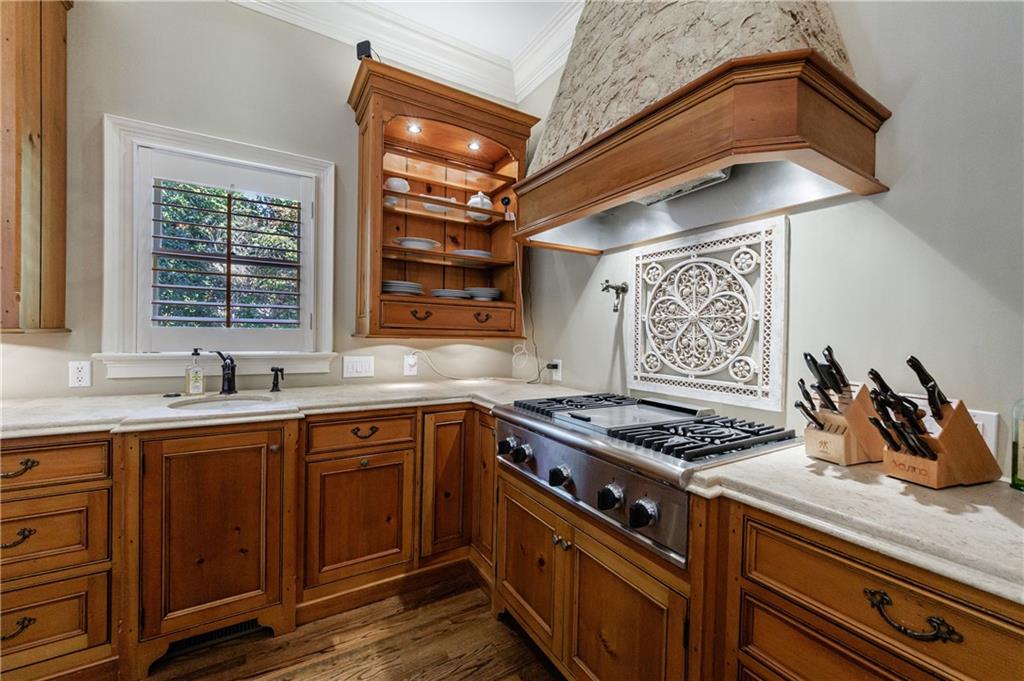 9390 Colonnade Trail Alpharetta, GA 30022 - Photo 24 of 122 a kitchen with stainless steel appliances granite countertop a sink stove and cabinets