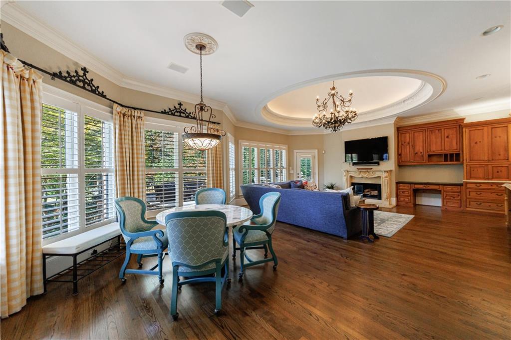 9390 Colonnade Trail Alpharetta, GA 30022 - Photo 26 of 122 a view of a dining room with furniture window and wooden floor