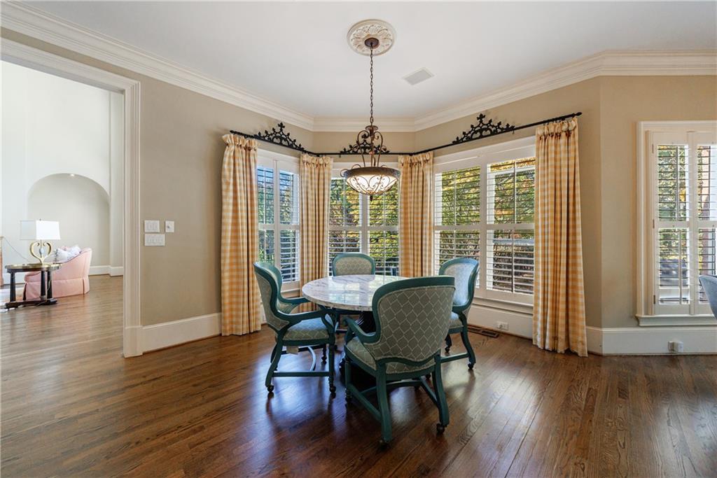 9390 Colonnade Trail Alpharetta, GA 30022 - Photo 27 of 122 a view of a dining room with furniture window and wooden floor