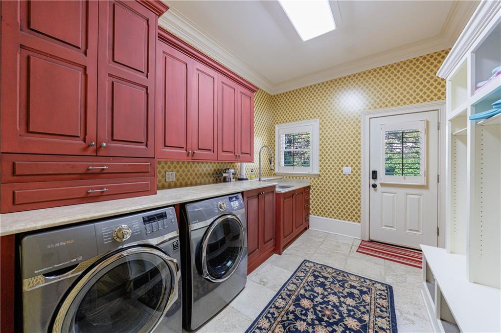 9390 Colonnade Trail Alpharetta, GA 30022 - Photo 30 of 122 a utility room with sink dryer and washer