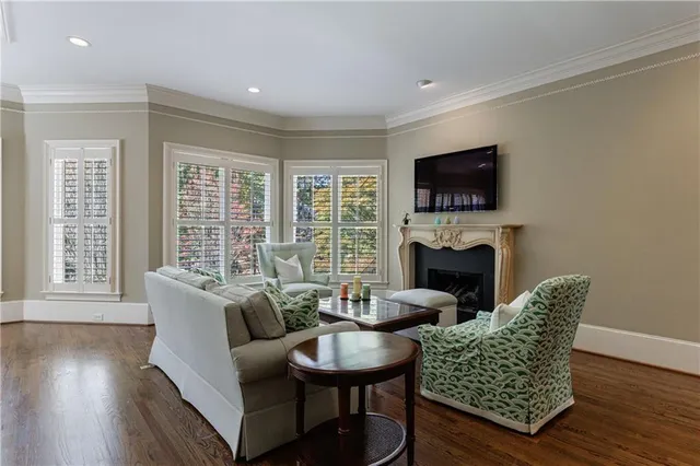 a kitchen with stainless steel appliances granite countertop white cabinets a sink and dishwasher