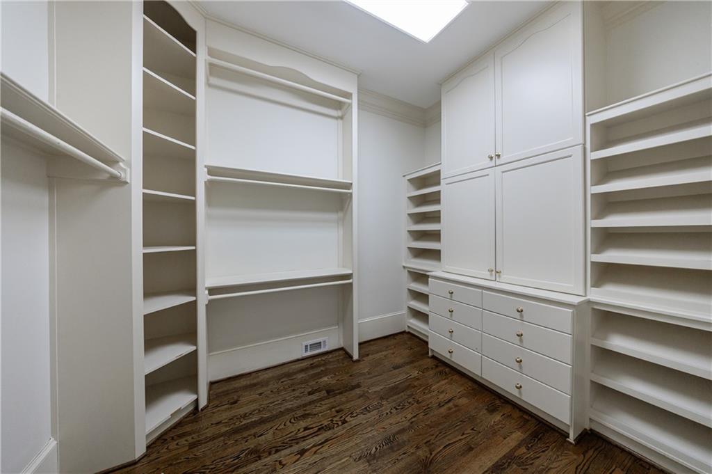 9390 Colonnade Trail Alpharetta, GA 30022 - Photo 37 of 122 a view of walk in closet with empty racks