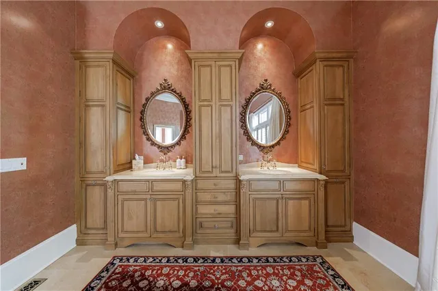 a front view of a house with a yard and green space