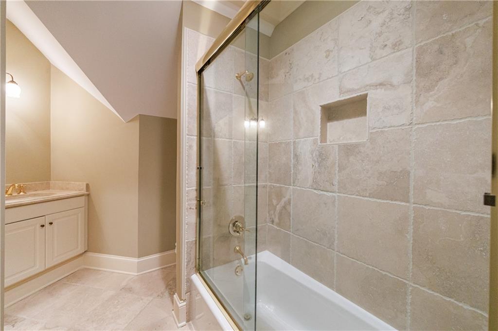 9390 Colonnade Trail Alpharetta, GA 30022 - Photo 60 of 122 a bathroom with a shower and a sink