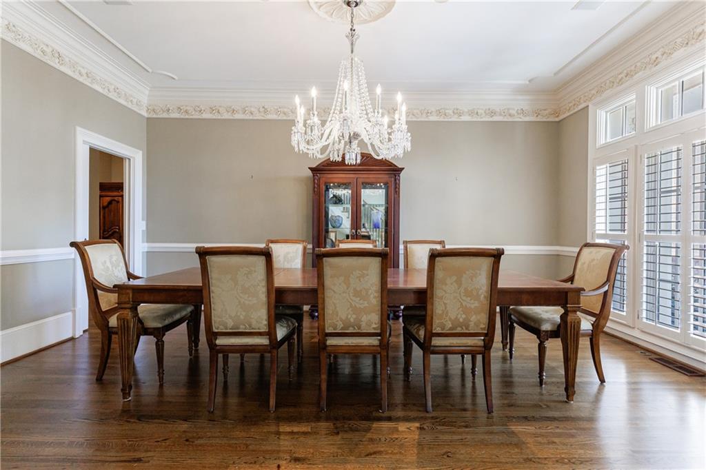 9390 Colonnade Trail Alpharetta, GA 30022 - Photo 6 of 122 a view of a dining room with furniture window and wooden floor