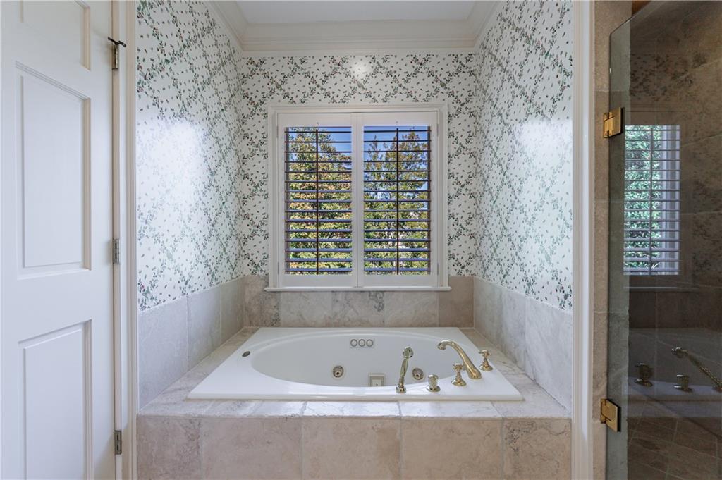 9390 Colonnade Trail Alpharetta, GA 30022 - Photo 67 of 122 a bath tub sitting in a bathroom next to a window