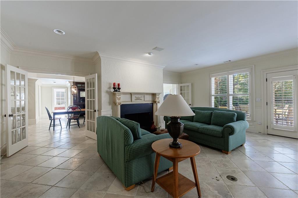 9390 Colonnade Trail Alpharetta, GA 30022 - Photo 79 of 122 a living room with furniture and a window
