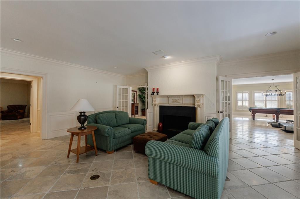 9390 Colonnade Trail Alpharetta, GA 30022 - Photo 80 of 122 a living room with furniture and a fireplace