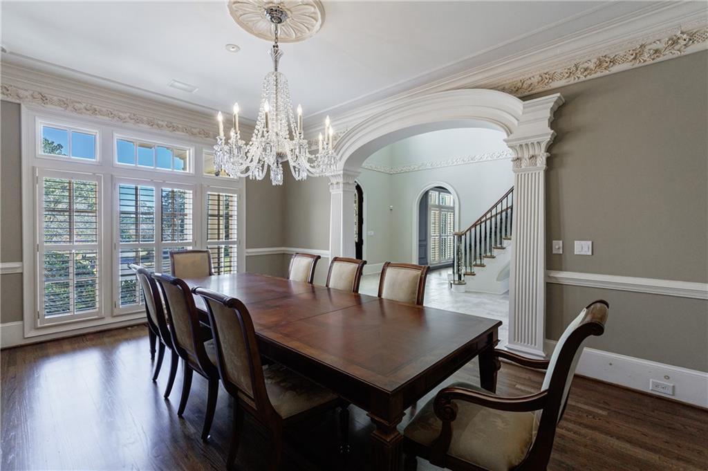 9390 Colonnade Trail Alpharetta, GA 30022 - Photo 8 of 122 a view of a dining room with furniture window and wooden floor