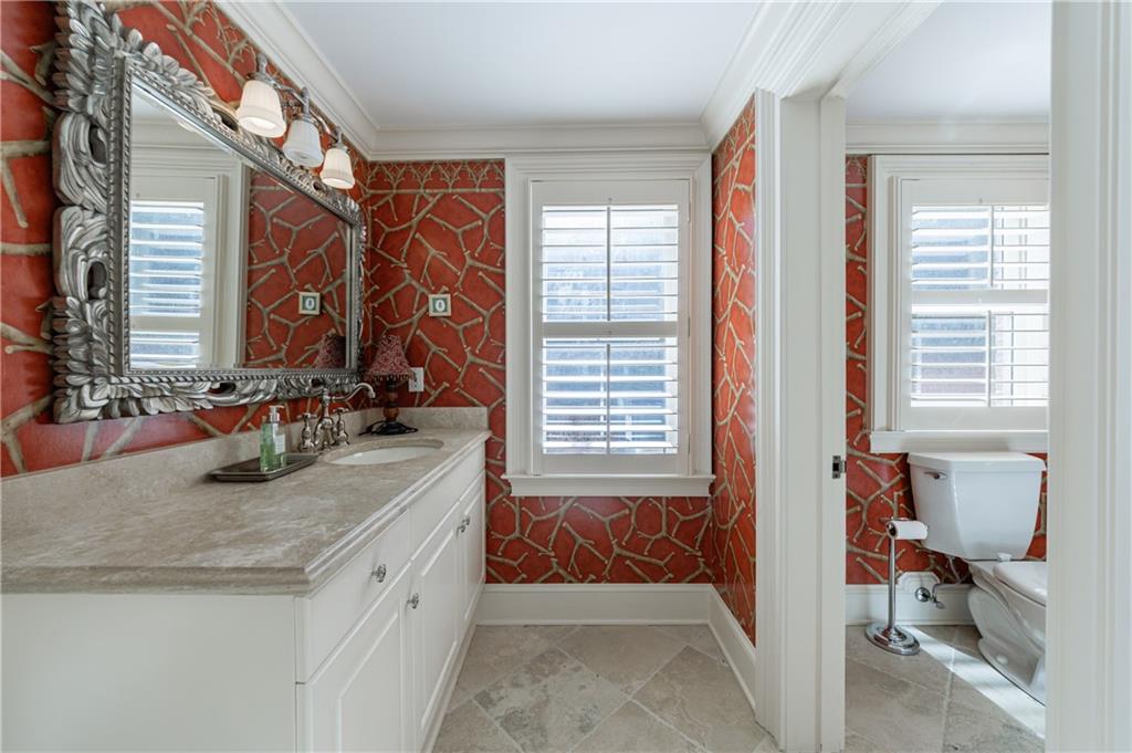 9390 Colonnade Trail Alpharetta, GA 30022 - Photo 88 of 122 a bathroom with a granite countertop sink and a mirror