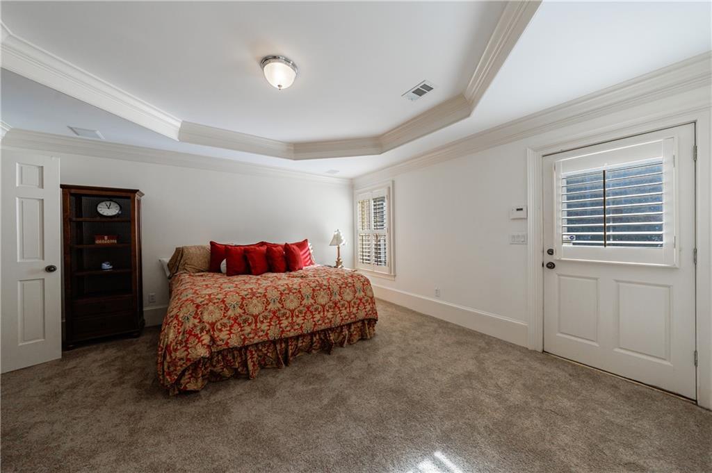 9390 Colonnade Trail Alpharetta, GA 30022 - Photo 89 of 122 a bedroom with a bed and a cabinets
