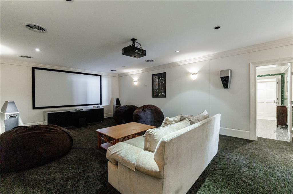 9390 Colonnade Trail Alpharetta, GA 30022 - Photo 92 of 122 a living room with furniture and a flat screen tv