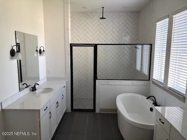a white bath tub sitting next to a bathroom sink