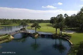 a view of a lake with houses in the back