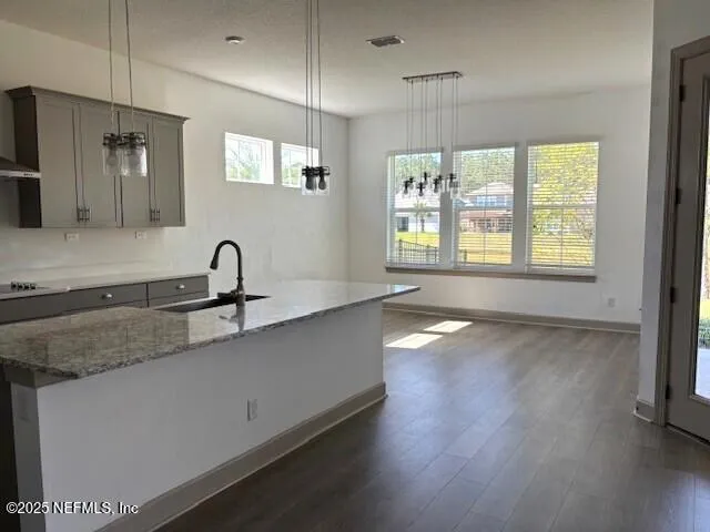 a view of a kitchen with a sink and a window