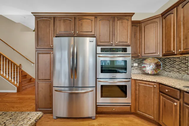a kitchen with appliances and cabinets