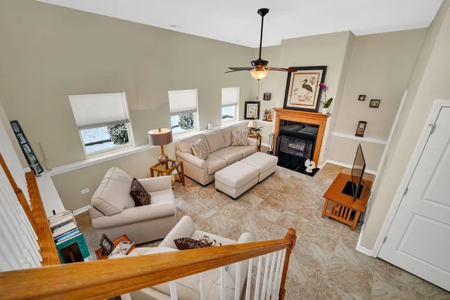 a living room with furniture and a fireplace