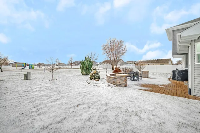 a view of a swimming pool and an outdoor seating