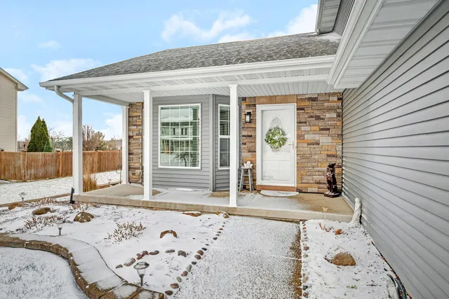 a view of a entryway door front of a house