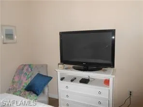 a room with furniture and flat screen tv