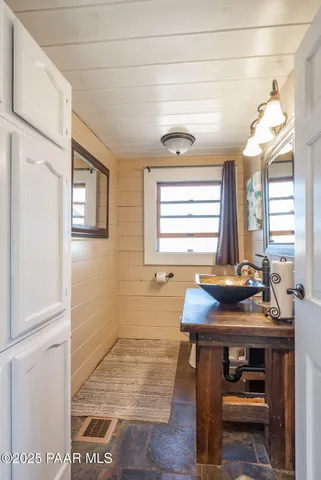 a kitchen with stainless steel appliances granite countertop a stove and a refrigerator