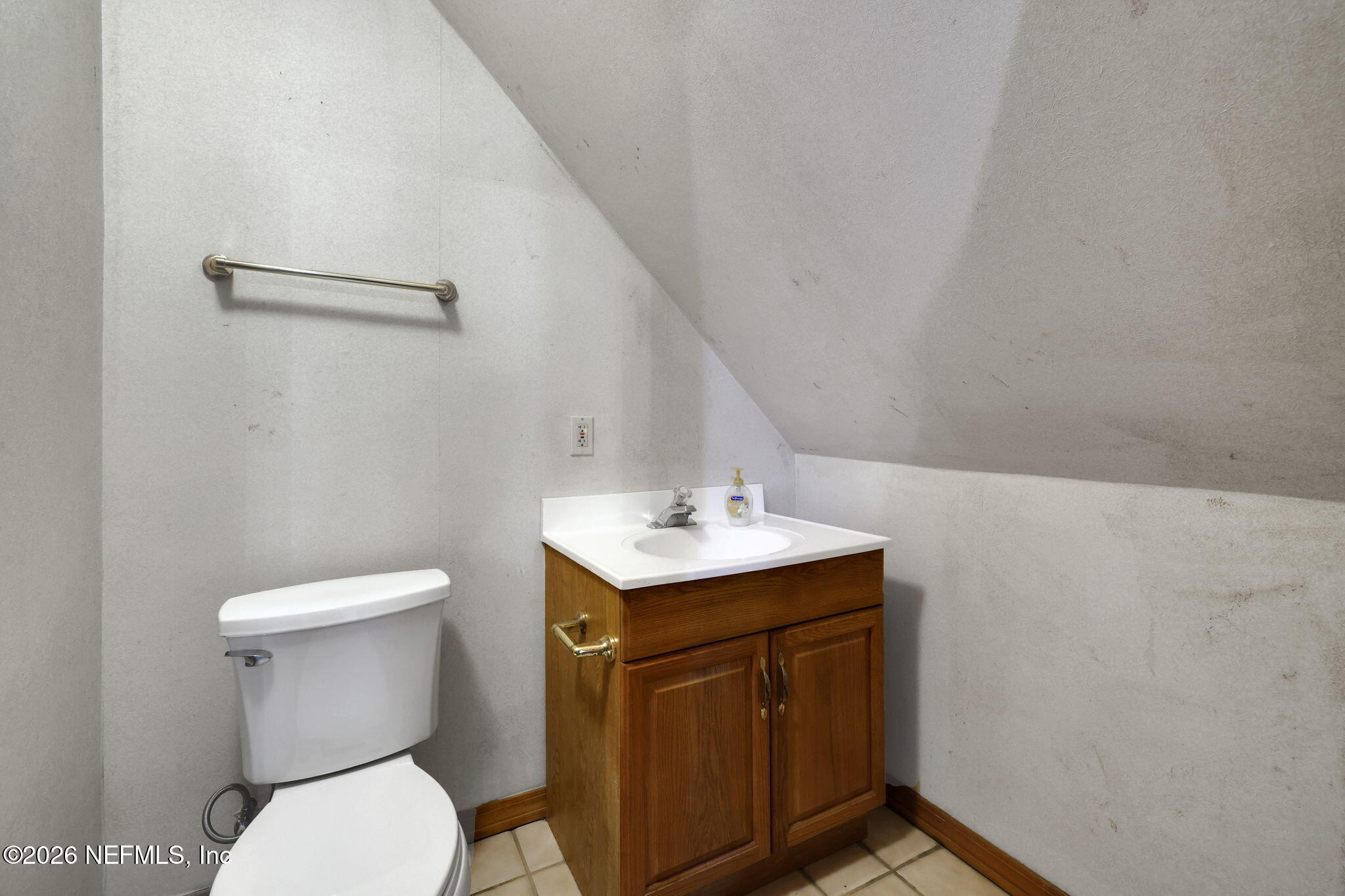 2160 Oak Street Jacksonville, FL 32204 - Photo 101 of 143 a bathroom with a sink a toilet and a mirror
